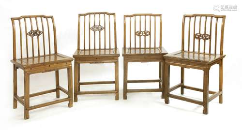 A set of four Chinese side chairs, 19th century, with shaped spindle-back rails with pierced panels ...