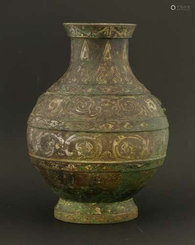 A Chinese bronze hu, Han dynasty (206 BC - AD 220), of globular form with splayed mouth, on a ...