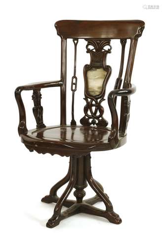 A Chinese revolving captain's armchair, early 20th century, the shaped back pierced and carved with ...