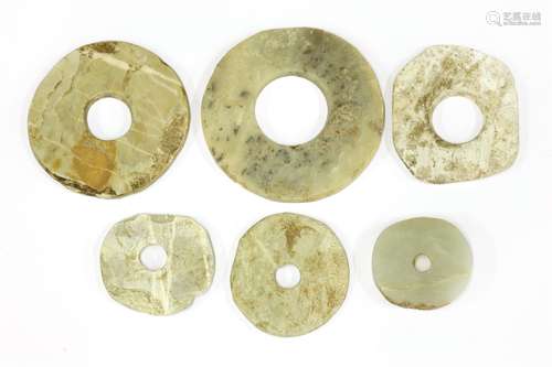 A group of Chinese jade bi disc, Neolithic period, Qijia Culture (2200 - 1600 BC), of typical form, ...