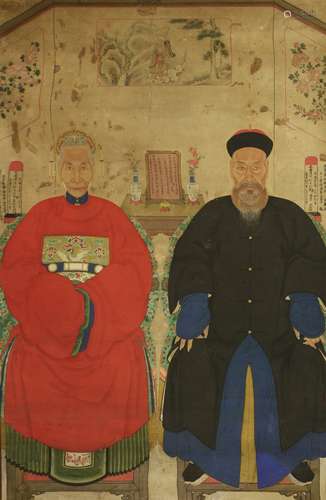 A large Chinese ancestor portrait painting, early 20th century, of an elderly couple seated on ...