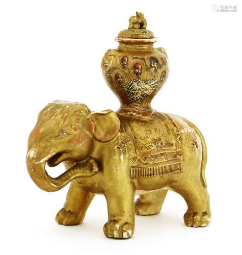 A Japanese Satsuma ware elephant, early 20th century, moulded with elaborate jewellery, a blanket ...