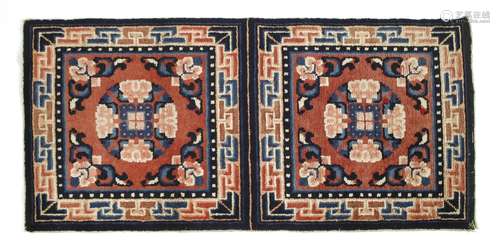 A Chinese Ningxia double mat, decorated with florets in red and blue within a key fret border ...