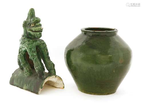 A Chinese green-glazed jar, Ming dynasty or later, 22.5cm high, and a roof tile with a beast seated ...