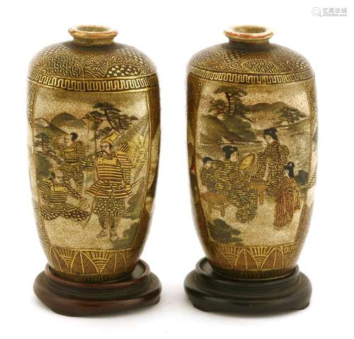 A pair of Japanese Satsuma ware vases, c.1900, of tapering square form, painted with figures in ...