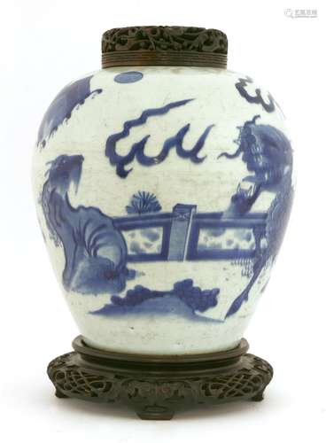 A Chinese blue and white ginger jar,  Transitional period, painted with qilin and another mythical ...