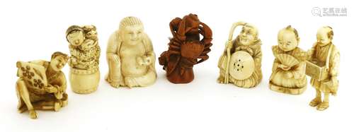 A collection of four Japanese ivory netsuke, Meiji period (1868-1912), comprising: a boy seated on ...