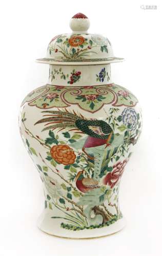 A Chinese famille rose vase and cover, early 20th century, of baluster form, painted with pheasants ...