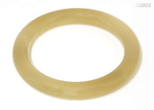 A Chinese agate bangle, c.1920, of plain, circular form, inner diameter 6.6cm, outer diameter 9cm