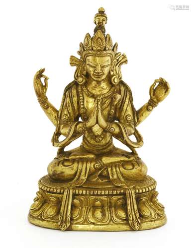 A bronze bodhisattva, seated cross-legged on a lotus pedestal, 10cm high