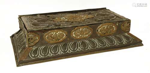 A large Tibetan bronze stand, of rectangular form on a lotus base, the top with dragons amongst ...