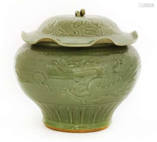 A Chinese Longquan ware jar and cover, Ming dynasty or later, of baluster form on a tapering foot, ...