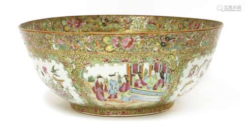 A Chinese Canton enamelled punch bowl, 19th century, painted with figures in a garden or birds and ...