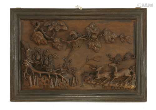 A pair of Chinese wooden panels, early 20th century, one with a pheasant standing on a peony branch ...