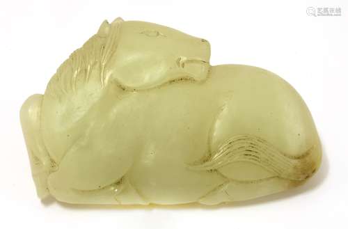 A Chinese jade belt hook, late Ming/early Qing dynasty, in the shape of a recumbent horse, its head ...