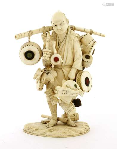 A Japanese ivory okimono, Meiji period (1868-1912), of a merchant carrying goods to sell, including ...