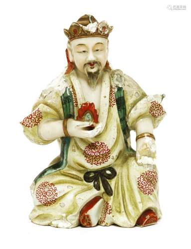 A Chinese porcelain figure, possibly Qianlong (1736-1795), wearing a tall hat and long robes, ...