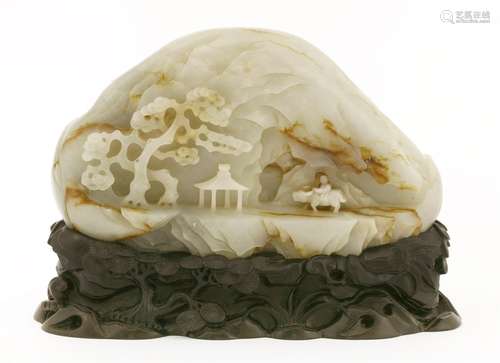 A Chinese jade carving, Qing dynasty (1644-1911), of a boy riding on a buffalo in a mountainous ...