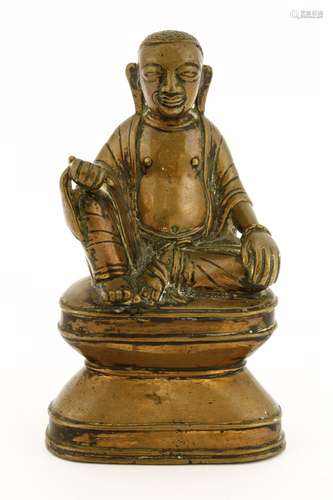 A Burmese bronze Buddha, 18/19th century, seated on a pedestal with his hands resting on his knees, ...