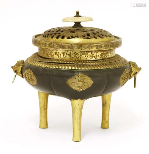 A Chinese gilt bronze incense burner, 17th/18th century, of melon form on three slender legs, ...