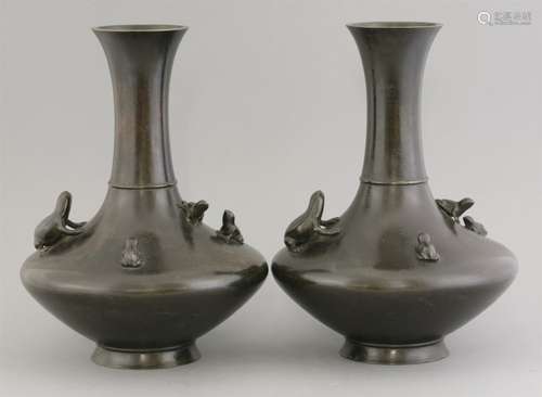 A pair of bronze vases, late 19th century, each of exaggerated onion form with trumpet mouth, ...