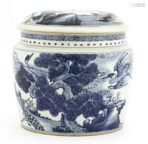 A Chinese blue and white jar and cover, 19th century, of cylindrical tapering form, painted with ...