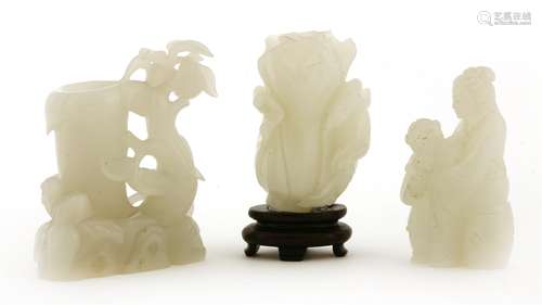 A collection of Chinese white jades, 20th century, comprising: one cabbage, 7cm high, associated ...