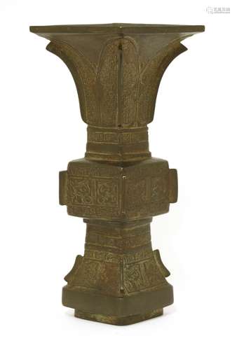 A Chinese bronze gu vase, Ming dynasty (1368-1644), of square form, moulded with archaic birds ...