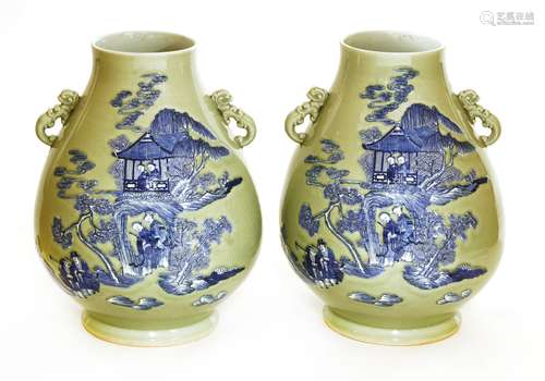 A pair of Chinese blue and white vases, each of pear shape, painted with figures in a pavilion or ...