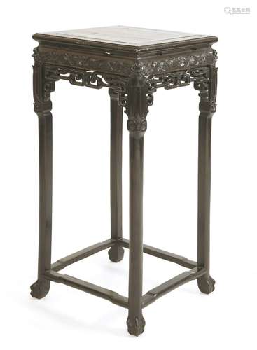 A Chinese vase stand, 19th century, the square top inset with rouge marble, above a pierced and ...