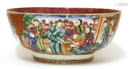 A Chinese famille rose punch bowl, painted with ladies and boys in a garden, in shaped panels ...