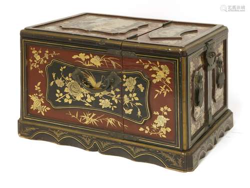 A Chinese lacquered wood toilet box, mid-19th century, painted in gilt with figures in a garden in ...