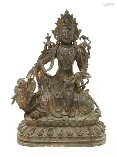 A Chinese bronze bodhisattva, in the Ming style, wearing elaborate dress and beaded jewellery, ...