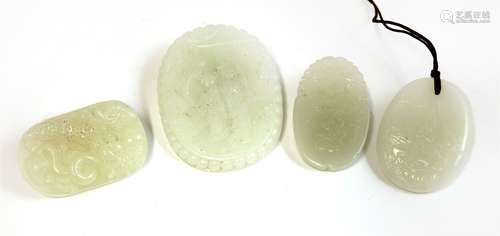 Four Chinese white jade plaques, 20th century, of oval form, one with a boy presenting a lingzhi in ...