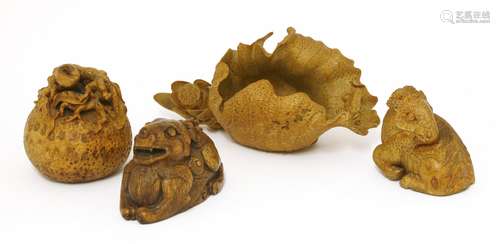 A collection of four palm wood carvings, 20th century, comprising a qilin, a goat, a fruit and a ...