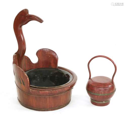 A Chinese wooden basin, in the form of a crane with its wings outstretched, enclosing an associated ...