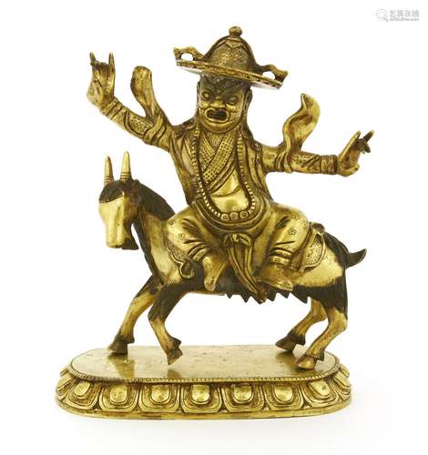 A Chinese gilt bronze bodhisattva, Qing dynasty (1644-1911), seated on the back of a horse with his ...