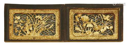 A pair of Chinese wood carvings, 19th century, one with egrets in a lotus pond, the other with ...