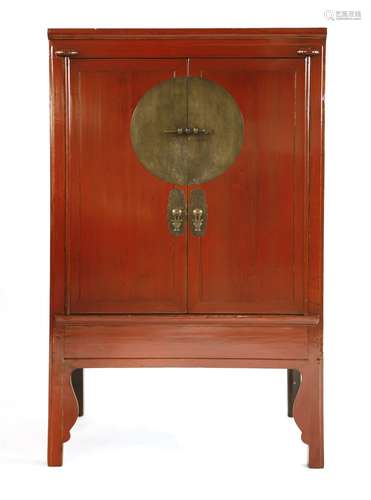 A Chinese wedding cabinet, early 20th century, with plain doors enclosing two small central ...