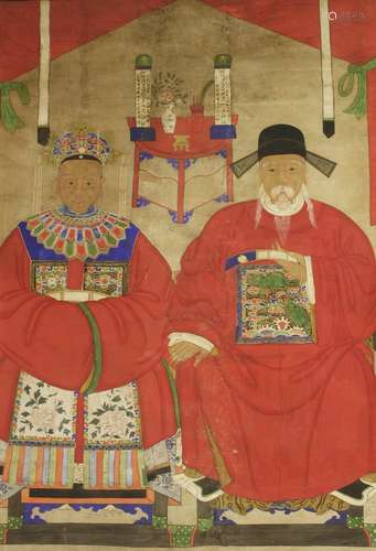 A large Chinese ancestor portrait painting, early 20th century, of an old couple seated on ...