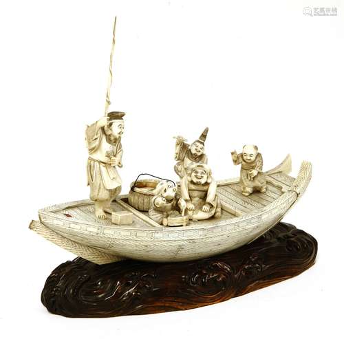 A Japanese ivory takarabune, late 19th century, the treasure ship constructed of simulated grained ...