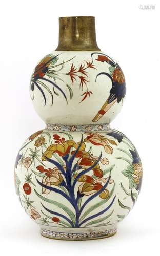 A Chinese wucai vase, Kangxi (1662-1722), of double gourd form, painted with sprigs of flowers ...