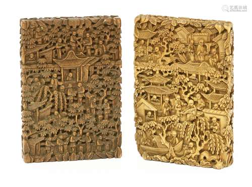 Two Chinese sandalwood card cases, late 19th century, carved with figures in a garden or on a boat, ...