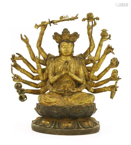 A Chinese bronze bodhisattva, seated cross-legged on a double lotus pedestal, with a pair of his ...