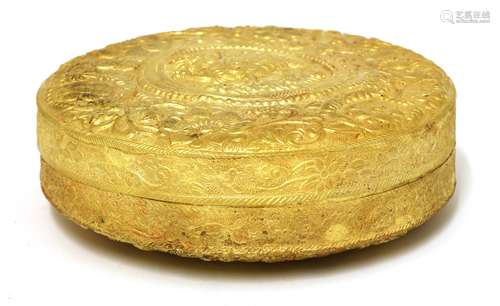 A Chinese gold box and cover, of circular form, the centre decorated with a qilin standing on ...