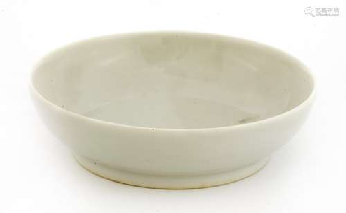 A Chinese porcelain saucer, of circular form under a white glaze, six character Qianlong mark, 9cm ...