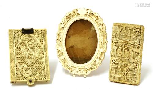 A collection of three Chinese ivory carvings, late 19th century, comprising one card case, ...