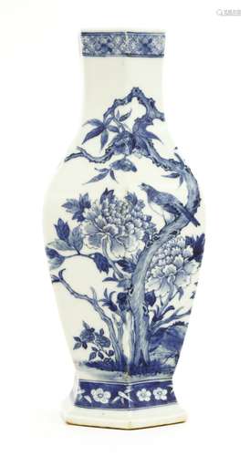 A Chinese blue and white vase, c.1900, of hexagonal form, painted with a bird standing on a ...