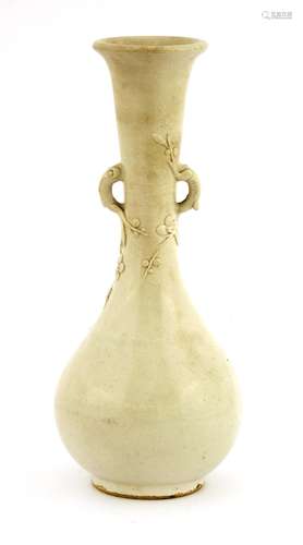 A Chinese white glazed vase, Qing dynasty or earlier, of globular form with a long tapering neck ...