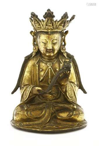 A Chinese gilt bronze bodhisattva, Ming dynasty (1368-1644), seated cross-legged in ankle-length ...